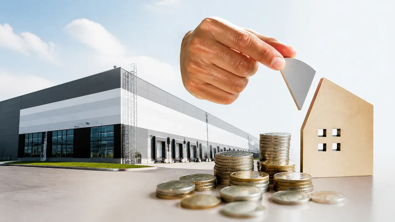 Galpão logístico e moedas representam o rendimento de setembro do HGLG11